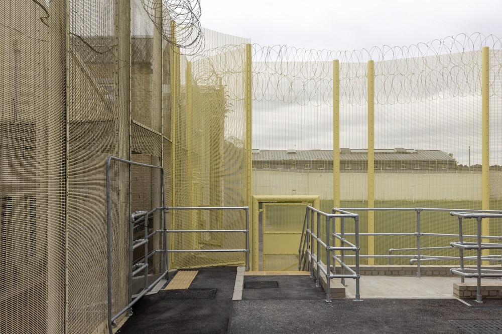 View from inside prison through high fences